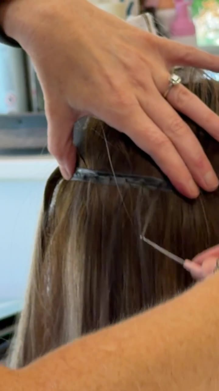 Drawing hair through along the weft