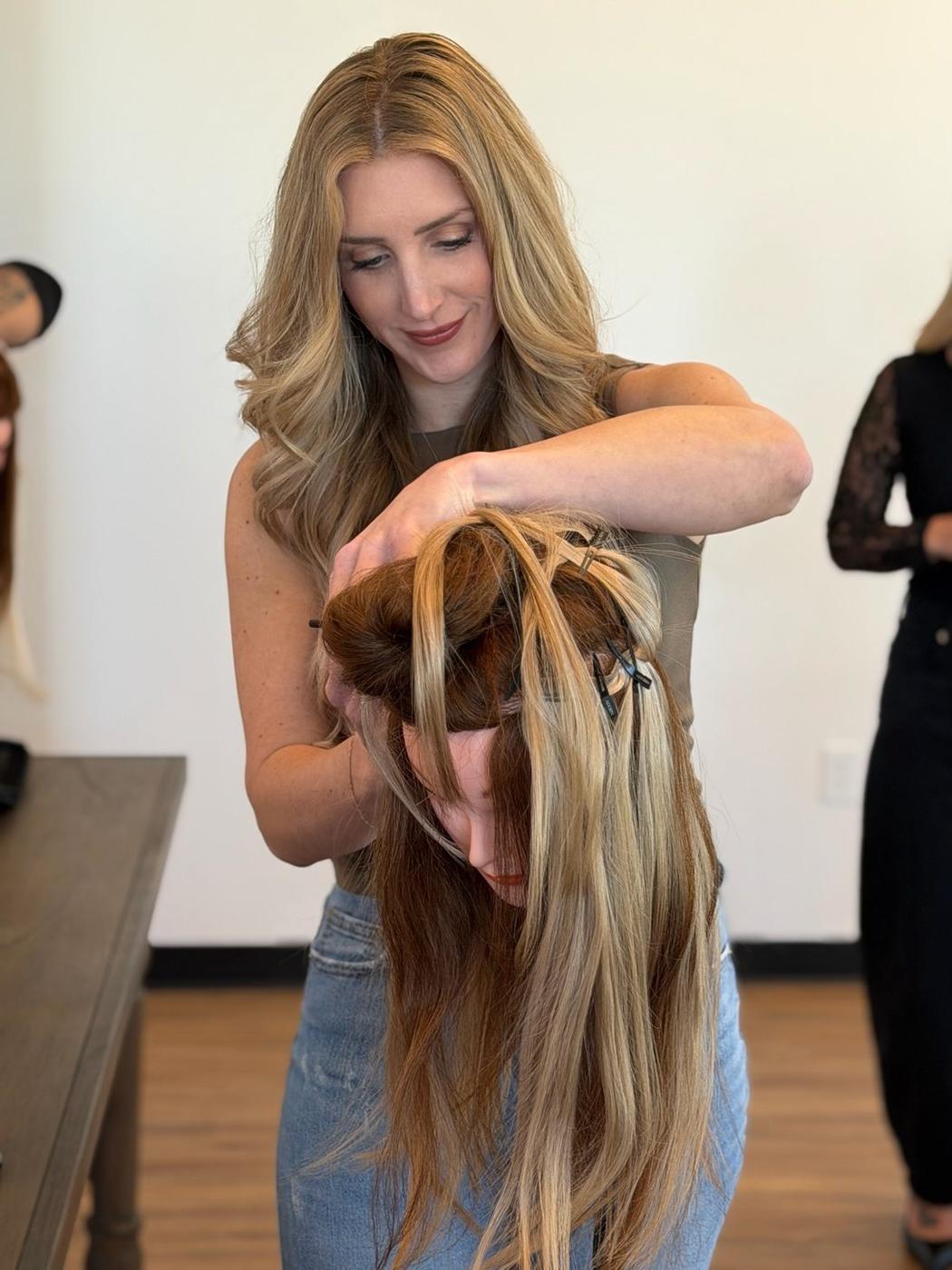 A student working a row on her mannequin