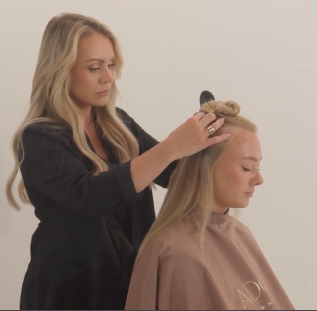 Jordan teaching the no-sew butterfly weft on a model